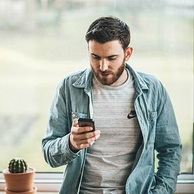 man on phone texting